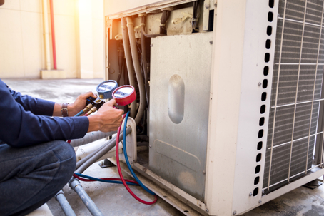technician checking an AC unit