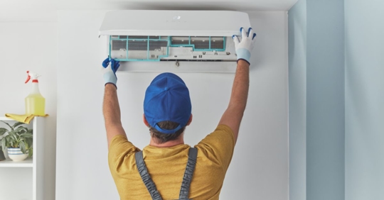 AC repairman working on unit